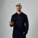 Man in navy jacket and white cap with 'Etiquette' logo juggling a white ball on gray background
